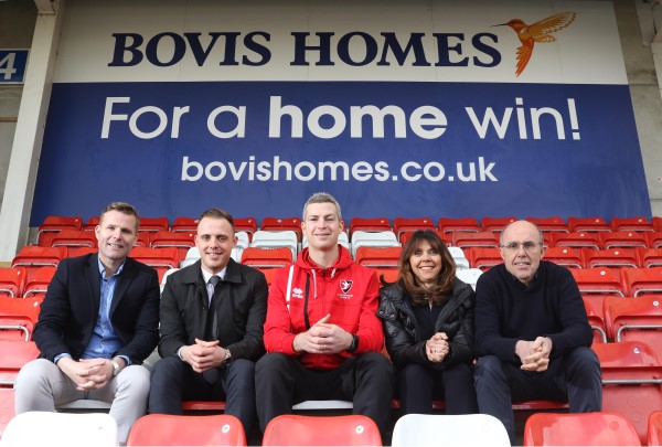 It's a home win for local house builder and Cheltenham Town